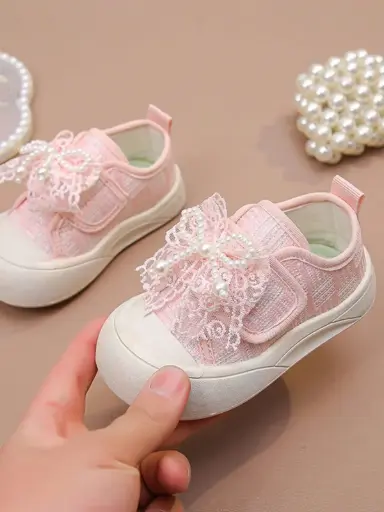 Zapatitos rosa con lazo de encaje para niña 